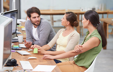 Image showing Creative, coworking space and man with women at desk for conversation, brainstorming and digital marketing. Computer, office and teamwork at online advertising agency with discussion for planning.