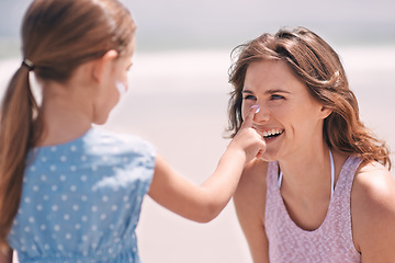 Image showing Happy mother, child and sunscreen on nose at beach for summer holiday, vacation or travel. Mom, kid and apply sunblock cream outdoor for protection, health and skincare of family laughing together