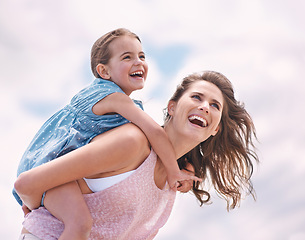 Image showing Mother, child and piggyback, happy on the beach for bonding and love, travel and vacation in Mexico. Freedom, care and trust, woman and daughter playing game with joy and family time together outdoor