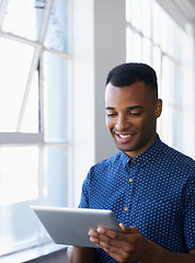 Image showing Businessman, tablet and online at window for networking, internet search and communication in office. Entrepreneur, african employee and happy with technology for corporate email and planning at work