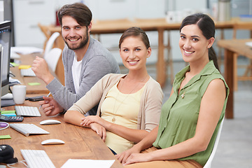 Image showing Portrait, freelancers and group smiling in office, desk or computer for collaboration, teamwork and creativity. Partnership, people and employees at workplace for writers, business or professionalism