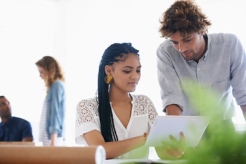 Image showing Creative people, tablet and coaching in planning, design or research on project at office. Man helping woman on technology for staff training, architecture or brainstorming ideas in startup workplace