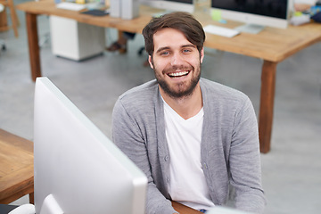 Image showing Man, portrait and journalist on computer for research in office, planning and information for article. Happy male person, online and connection for website, laughing and humor for project or news