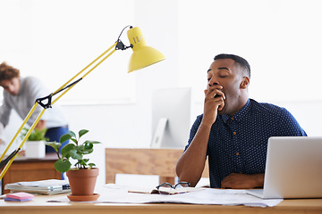 Image showing Business, yawn and tired black man in office and stress, burnout or fatigue by laptop in creative startup. Bored, sleepy and exhausted professional, overworked or designer with brain fog for deadline