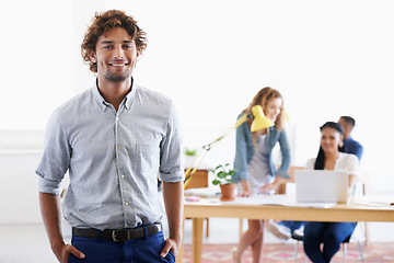 Image showing Man, portrait and confident with happiness in office for working as marketing manager for communications company. Male person, employee and smile for creative career, job and commitment for agency