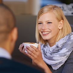 Image showing Woman, relax and smile in morning with coffee for start of day, together with friend and talking in cafe for catchup before work. Female person, calm and happy with cup expresso with discussion