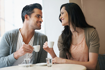Image showing Date, coffee and couple at cafe with relax, smile and together with love and hot drink at a table. Espresso, morning and happy marriage at a restaurant with bonding, care and romance at bistro