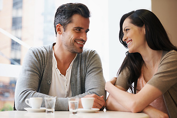 Image showing Love, talking and couple with coffee on date for romance or anniversary in cafeteria. Happy, bonding and young man and woman in conversation drinking latte, espresso or cappuccino at restaurant.