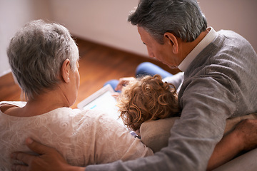 Image showing Child, grandparents and tablet on couch for online technology or communication, teaching or connection. Elderly couple, retirement and girl or internet learning in apartment, development or bonding