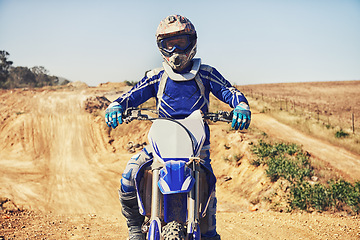 Image showing Person, portrait and motorcyclist on dirt bike for extreme sports, outdoor competition or race. Expert or professional rider on motorbike or scrambler on sand course for challenge or off road rally