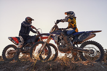 Image showing Sport, racer or people on motorcycle outdoor on dirt road with relax after driving, challenge or competition. Motocross, motorbike or dirtbike driver with helmet on offroad course or path for racing