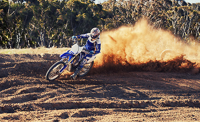 Image showing Person, dirt bike and professional motorcyclist racing in extreme sports or competition on outdoor track. Expert rider on motorbike or scrambler for sand course, challenge or off road rally in nature