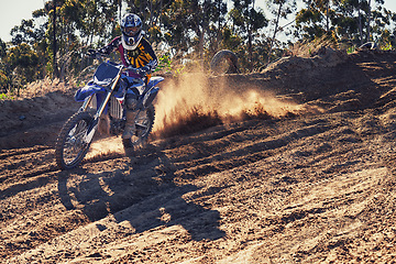 Image showing Motorbike, racer and speed with dust cloud for games, contest or challenge in portrait for extreme sports. Person, motorcycle and dirt on path, road and trail in nature for fast transport in summer