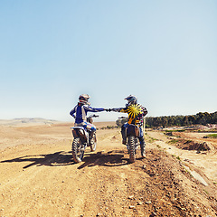 Image showing Sport, teamwork or people on motorcycle outdoor on dirt road before racing, challenge or competition on mockup. Motocross, dirtbike driver and fist bump with helmet on offroad course for performance