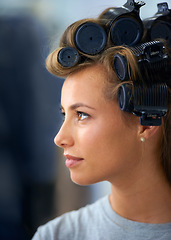 Image showing Woman, face and confident with hair curlers for beauty, haircare or hairstyle and makeup or cosmetics at hairdresser. Person, pride and roller set for grooming, curling or getting ready with skincare