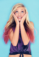 Image showing Young woman, thinking and wish in studio mock up in punk fashion and expression in rock style. California, blonde model and idea in trendy clothes and planning in gen z aesthetic by blue background