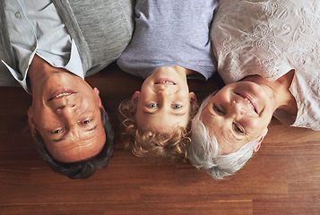 Image showing Portrait, grandparents and boy on the floor, love and bonding together with joy or apartment. Family, face or old man with elderly woman, kid or grandchild with fun or cheerful with home or vacation