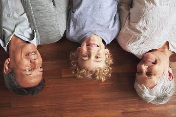 Image showing Portrait, grandparents and boy on the wooden floor or bonding together with vacation or apartment. Family, face or elderly man with old woman, grandkid or child with fun or cheerful with home or love