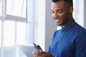 Image showing Businessman, tablet and online at window for communication, internet search and networking in office. Entrepreneur, african employee and happy with technology for corporate email and planning at work