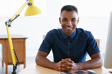 Image showing Young businessman, portrait and confident in office by desk, consultant and creative in fashion. Happy, black man or positive face of designer in co working space or about us for ambition in company