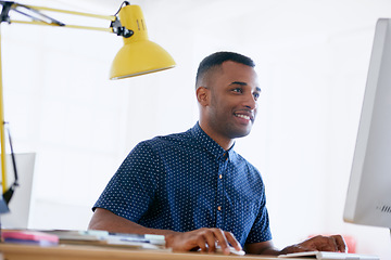 Image showing Businessman, happy or working in office on desktop, planning or ambition with productivity in career. Journalist, smile and typing on computer for networking and online research for creativity in job