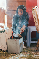 Image showing Ethiopian traditional Coffee ceremony, crafting street bunna coffee, Adigrat Mazegaja Bet Etiopia