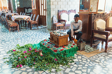 Image showing Ethiopian traditional Coffee ceremony, crafting street bunna coffee, Maqale Etiopia