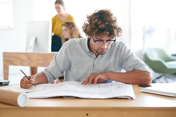 Image showing Paper, table and architect with floor plan in office for writing, brainstorming and building design. Strategy, man and blueprint on desk with thinking for idea, vision and property development