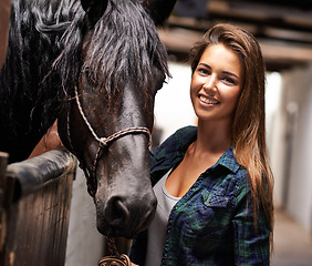 Image showing Woman, portrait and happy with horse in stable for bonding, sports training and recreation in Texas. Stallion, cowgirl and animal or face on barn with smile for healthy livestock, hobby and pet care