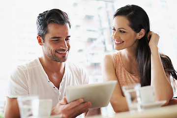 Image showing Happy couple, coffee and relaxing in cafe with tablet, smile and together for romance. Cheerful relationship, man and woman with love connection enjoying, technology and dating in restaurant