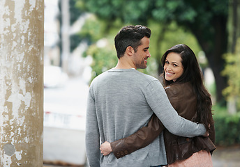 Image showing Happy couple, portrait and walking in park with love, embrace and bonding together on vacation in city. Husband, wife and smile on face on romantic date, holiday and adventure in italy for honeymoon