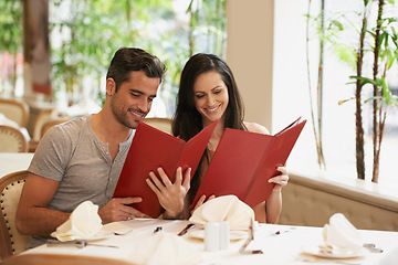 Image showing Couple, restaurant and menu for choice, conversation and bonding on valentines day. People, love and romance at cafe or lunch selection at bistro, cuisine and happy in relationship or laugh for joke