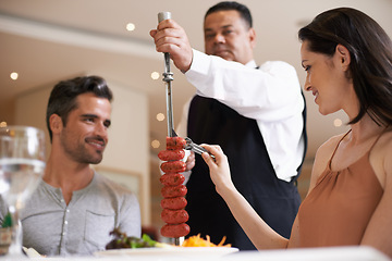 Image showing Couple, restaurant and date for eating, service and love for celebration on holiday. Woman, man and fine dining with luxury, smile and romance for vacation or marriage anniversary with gourmet meal