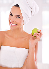 Image showing Happy woman, portrait and skincare with apple for nutrition, diet or healthy vitamins at home. Face of female person or model with smile and organic green fruit for natural sustainability or wellness