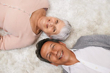 Image showing Portrait, elderly or happy couple on carpet to relax in home for bonding or support together. Smile, old people or man lying down on mat by a senior woman for love, retirement or care in marriage