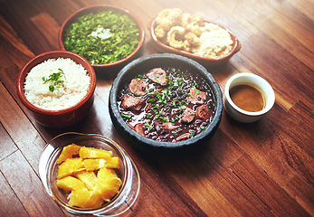 Image showing Black beans, vegetables and Mexican food on table with Mediterranean cooking, vegan and nutrition for diet. Health, green and dish at restaurant or diner with organic, salad and appetizer for dinner