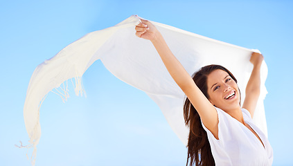Image showing Portrait, smile and woman with fabric in wind outdoor for summer, vacation or laugh on holiday. Scarf, happy person and fly with silk in the air for freedom, adventure and face in breeze on blue sky
