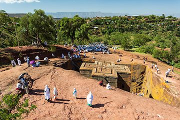 Image showing Orthodox christian Ethiopian people behind famous rock-hewn church, Lalibela Ethiopia people diversity,