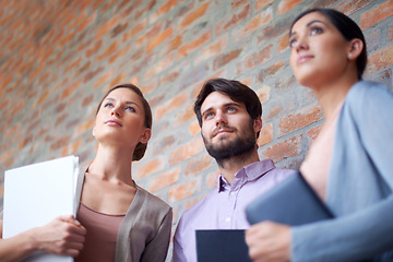 Image showing Business, colleagues and together while thinking of ideas for work project, collaboration and teamwork for workplace. Coworkers, employees and standing with vision for company, job and bottom view