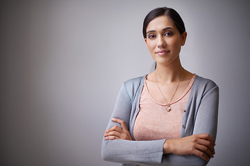 Image showing Space, designer or portrait of woman in studio with arms crossed, business or confidence. Creative person, employee or proud entrepreneur with startup, project or mockup isolated on grey background