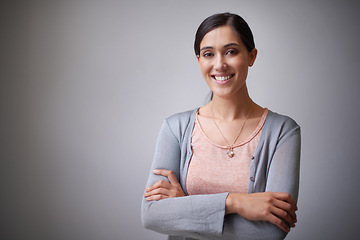 Image showing Space, designer or portrait of happy woman in studio with arms crossed, business or confidence. Creative, employee or proud entrepreneur with startup, project or mockup isolated on grey background