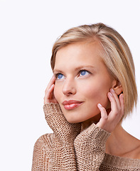 Image showing Studio, woman and skincare with sweater, vision and smile with happiness and satisfaction. Model, jersey and fashion for winter, care and treatment with comfort clothes or cardigan with style