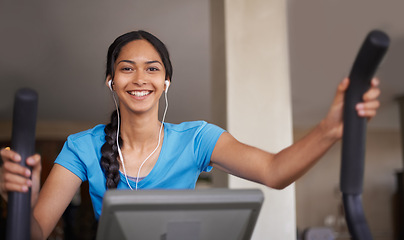 Image showing Woman, earphones and portrait for cycling, music and stationary machine for workout at club. Female person, cardio and podcast for strength training, playlist and equipment for fitness and health