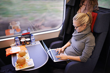 Image showing Woman, train and laptop typing with travel with internet for writing proposal or transportation, commute or blogger. Female person, meal and journey in Canada with online, networking or remote work