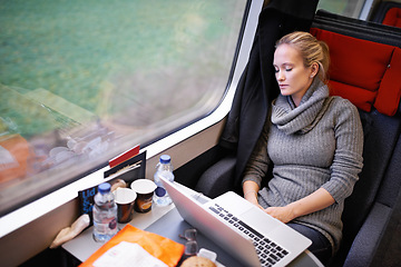 Image showing Woman, train and sleep with travel or laptop or relax commute or journey tired, window or transportation. Female person, railroad and seat resting in Canada as passenger for comfort, internet or trip