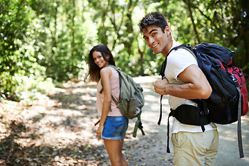 Image showing Hiking, walking and portrait of couple in nature for adventure, fitness and explore with backpack outdoors. Forest, travel and man and woman on trail for holiday, vacation and trekking for wellness