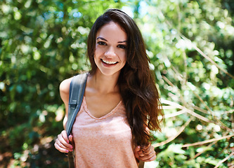 Image showing Nature, hiking and portrait of woman with backpack for outdoor adventure trail on vacation. Smile, travel and female person with bag for trekking in forest, field or woods on holiday or weekend trip.