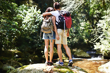 Image showing Hug, nature and back of couple in forest for hiking, trekking and adventure for wellness, relax and explore. Dating, love and man and woman on holiday, vacation and travel on weekend for exercise
