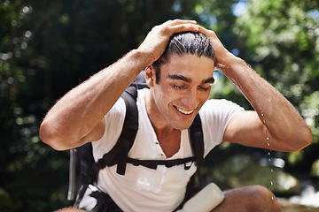 Image showing Travel, hiking and wet man with water for adventure, vacation or holiday with backpack in Colombia. Nature, forest and young male person trekking with bag by lake for refresh in woods on weekend trip