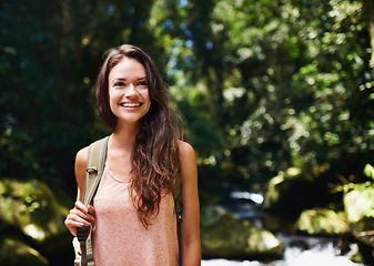 Image showing Hiking, forest or happy woman with smile in nature or wilderness for a trekking adventure. Relax, bag or excited female hiker walking in a natural park or woods for exercise or wellness on holiday